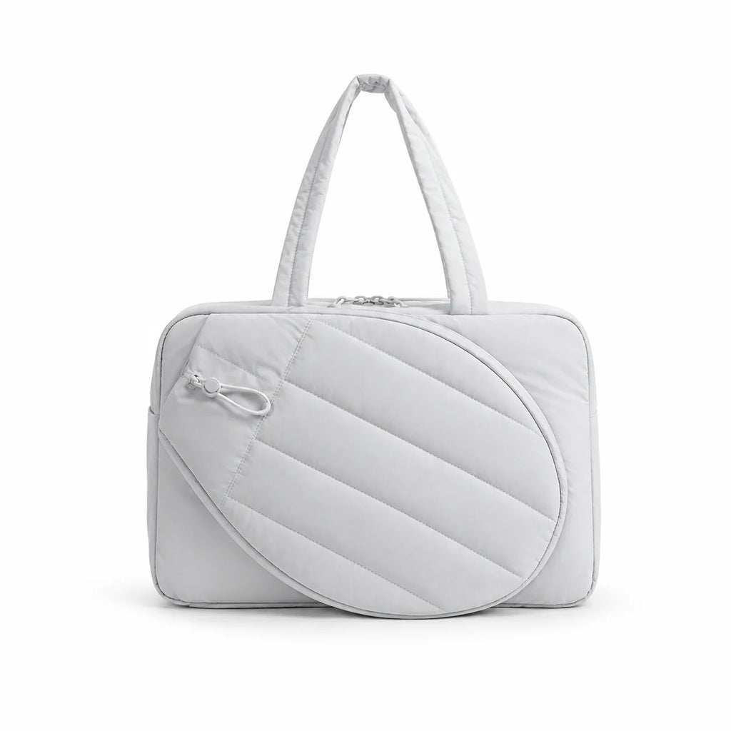 Sac bandoulière pickleball coloris gris clair, vue de face avec anses courtes et poche raquette ovale